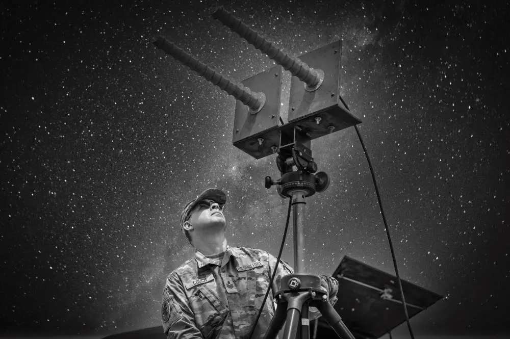 A U.S. Space Force technician conducts GPS interference training with a GPS electromagnetic attack system at Schriever Space Force Base, Colorado. U.S. adversaries will attempt to jam GPS signals during conflicts. Credit: SpaceNews photo illustration/U.S. Space Force photo by Ethan Johnson